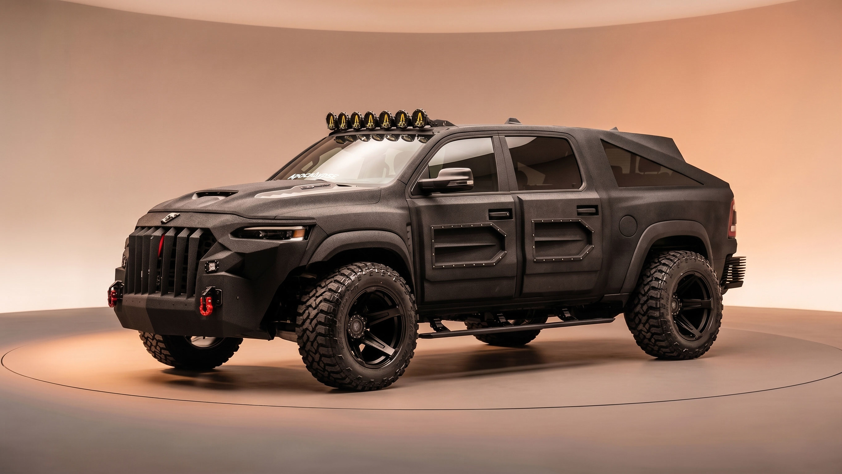 Black customized Jeep Grand Wagoneer SUV with open doors, roof rack, and tactical modifications on tan background