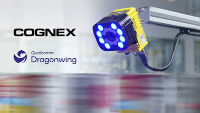 Cognex industrial blue LED machine vision light with yellow housing mounted on factory equipment