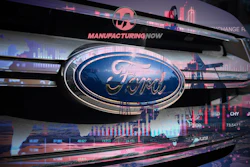 Ford vehicle grille with blue oval logo displayed in manufacturing advertisement with financial data visualizations and industrial cityscape background
