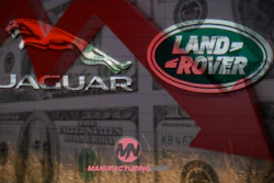 Jaguar and Land Rover luxury automotive brand logos displayed on signage with manufacturing facility backdrop