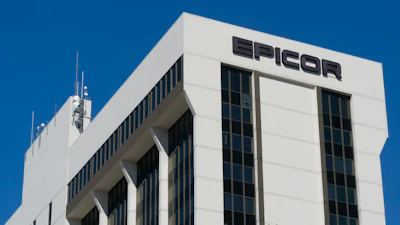 Epicor corporate office building with white facade and black signage against clear blue sky