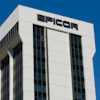 Epicor corporate office building with white facade and black signage against clear blue sky