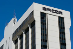 Epicor corporate office building with white facade and black signage against clear blue sky