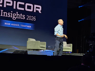 Speaker presenting at Epicor Insights 2026 conference on stage with tagline 'Soar Higher, Together'