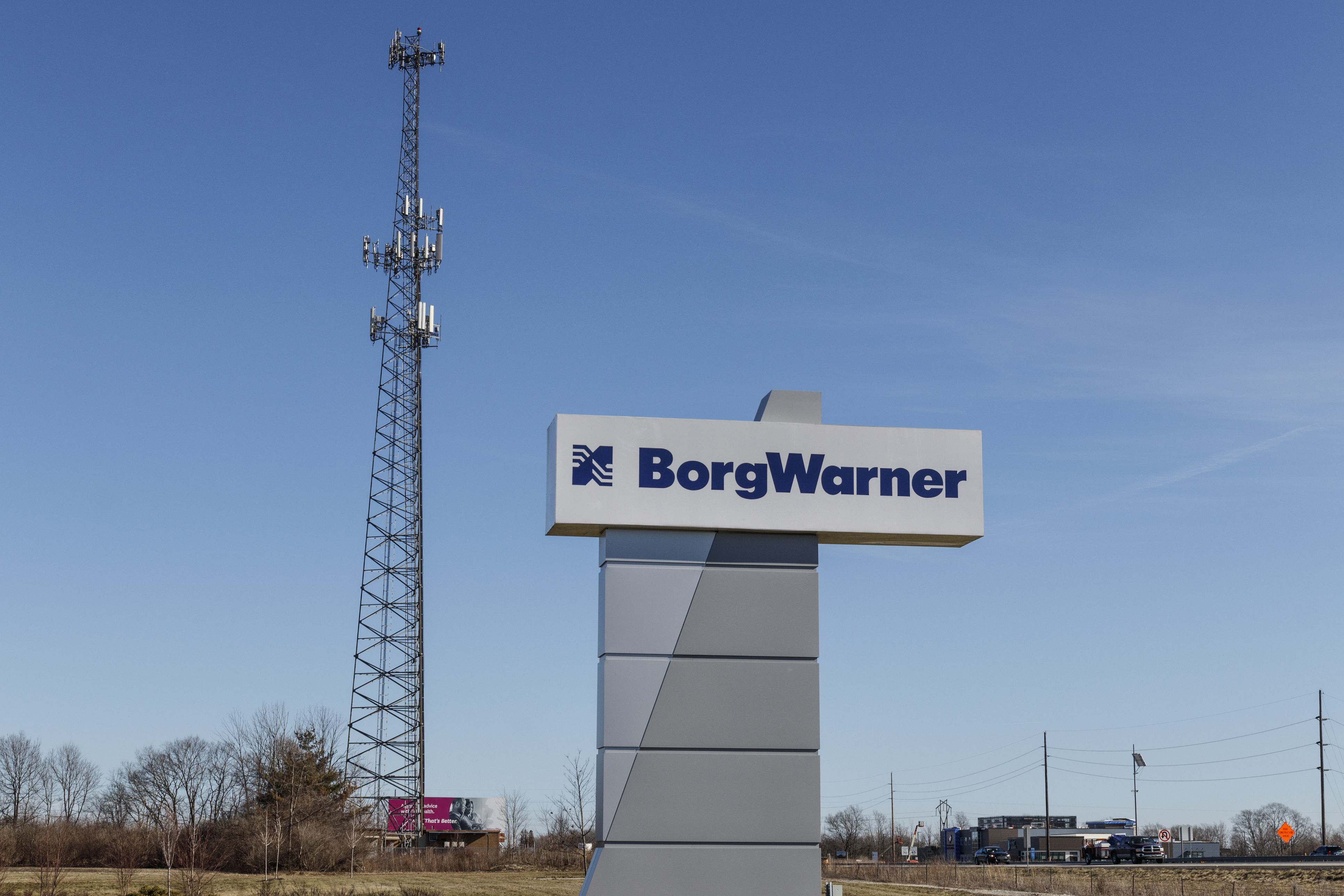 BorgWarner corporate sign with communication tower at industrial facility