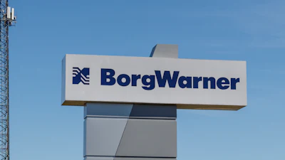 BorgWarner corporate sign with communication tower at industrial facility