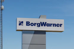 BorgWarner corporate sign with communication tower at industrial facility