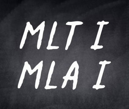 Handwritten text reading MLTI and MLAI on a dark chalkboard surface