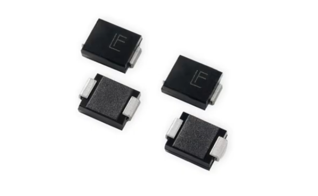 Four black electronic diodes or rectifier components with metallic leads arranged on white background