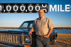 Man standing beside vintage Chevrolet truck with 1 million miles odometer reading displayed