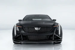 Black Cadillac luxury sedan front view with distinctive grille and LED headlights on white background