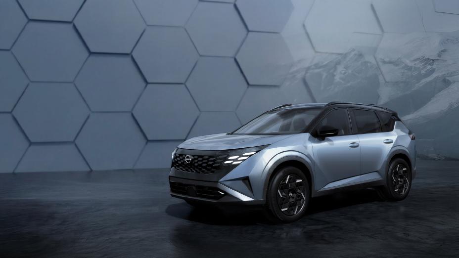 Silver Nissan SUV displayed against hexagonal patterned backdrop with mountain landscape