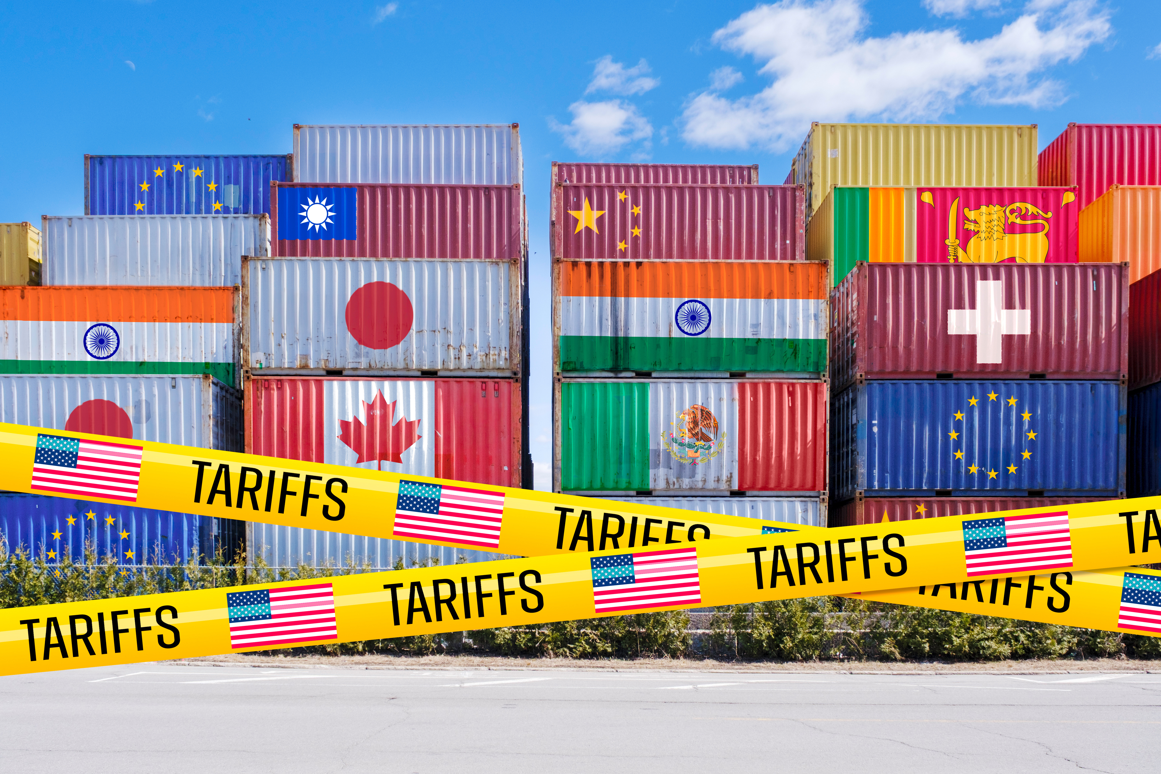 Stacked shipping containers with country flags blocked by yellow tariffs warning tape