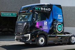 Blue hydrogen fuel cell truck with HYROAD branding and Toyota Hydrogen Solutions livery parked at facility