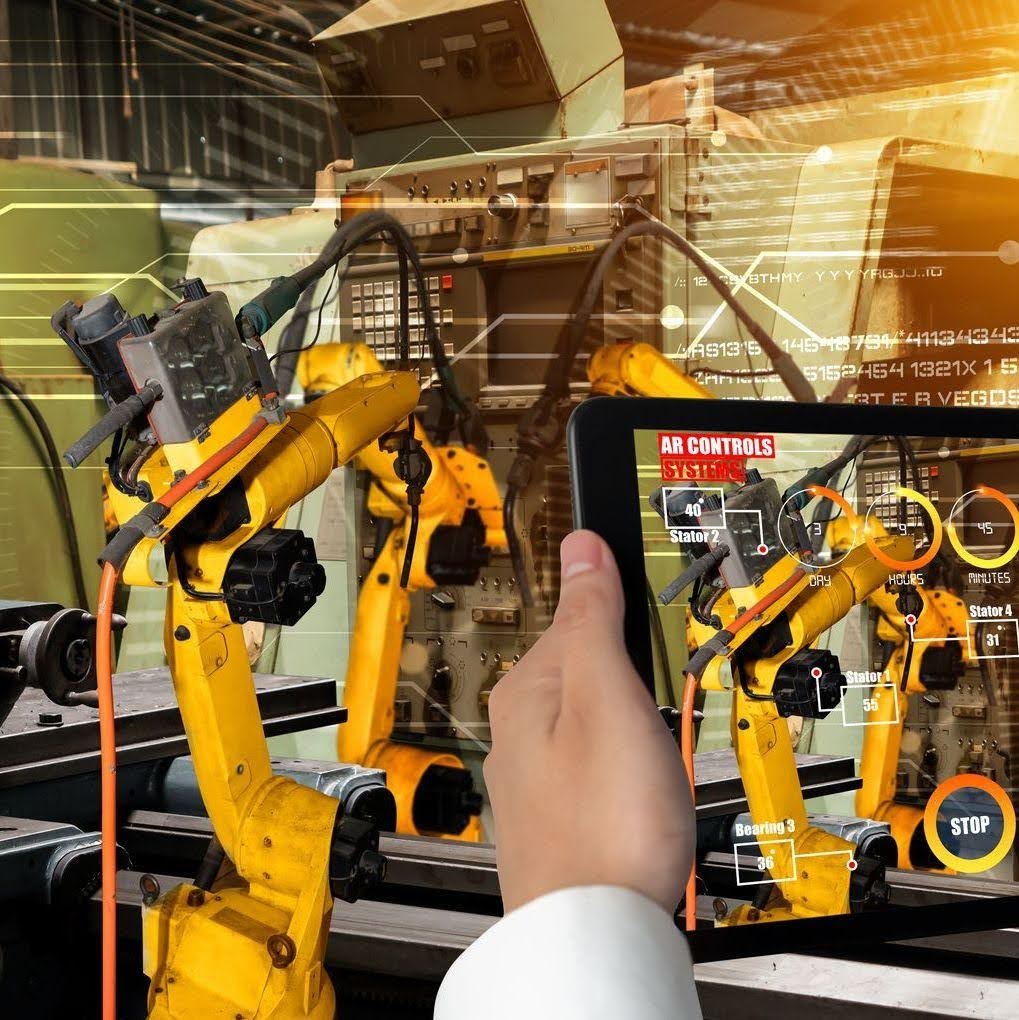 Augmented reality interface displaying industrial robotic arms with control panels and operational overlays in a warehouse setting