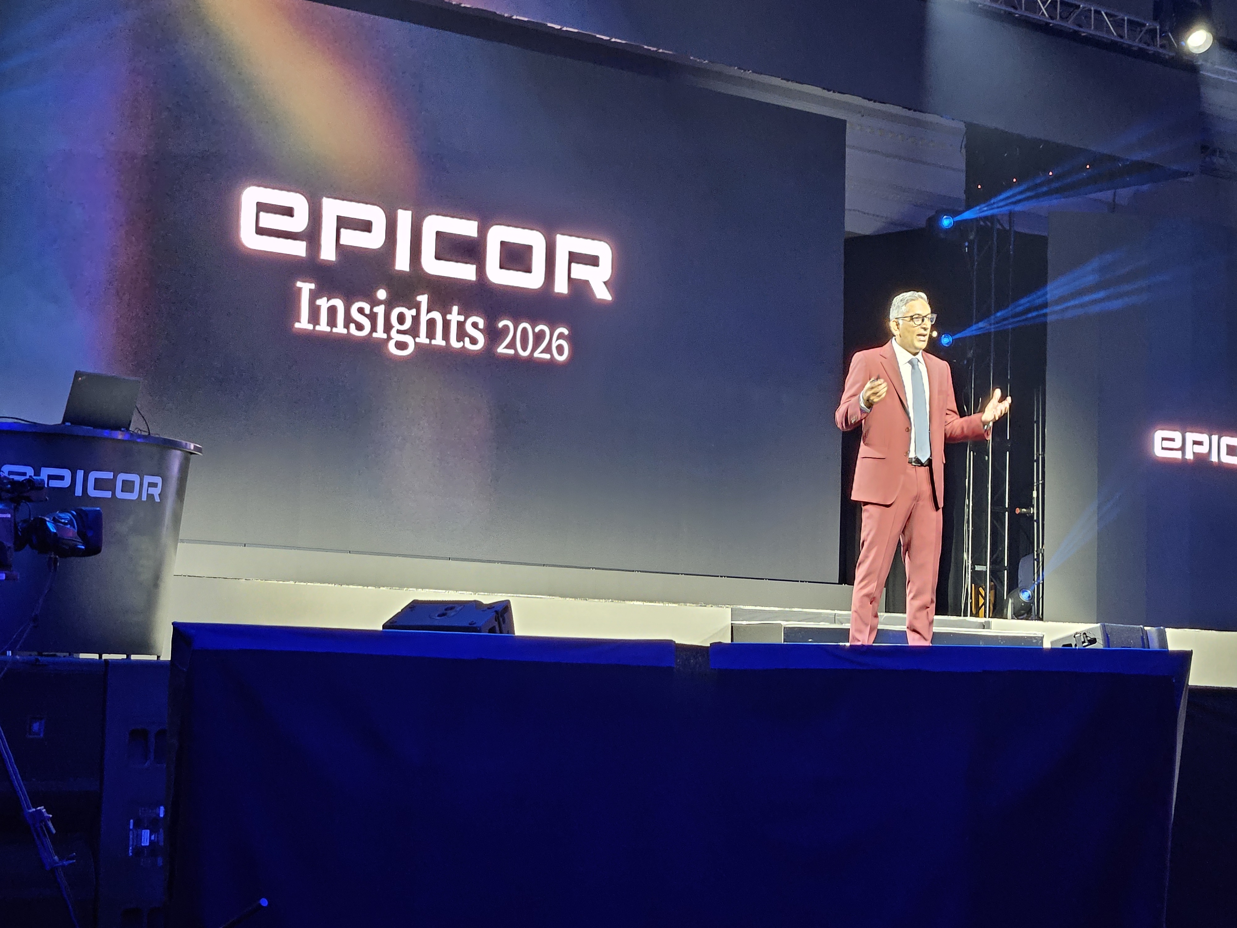 EPICOR Insights 2026 conference presentation with speaker on stage