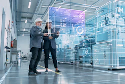 Two business professionals collaborating in modern tech facility with digital interface overlay