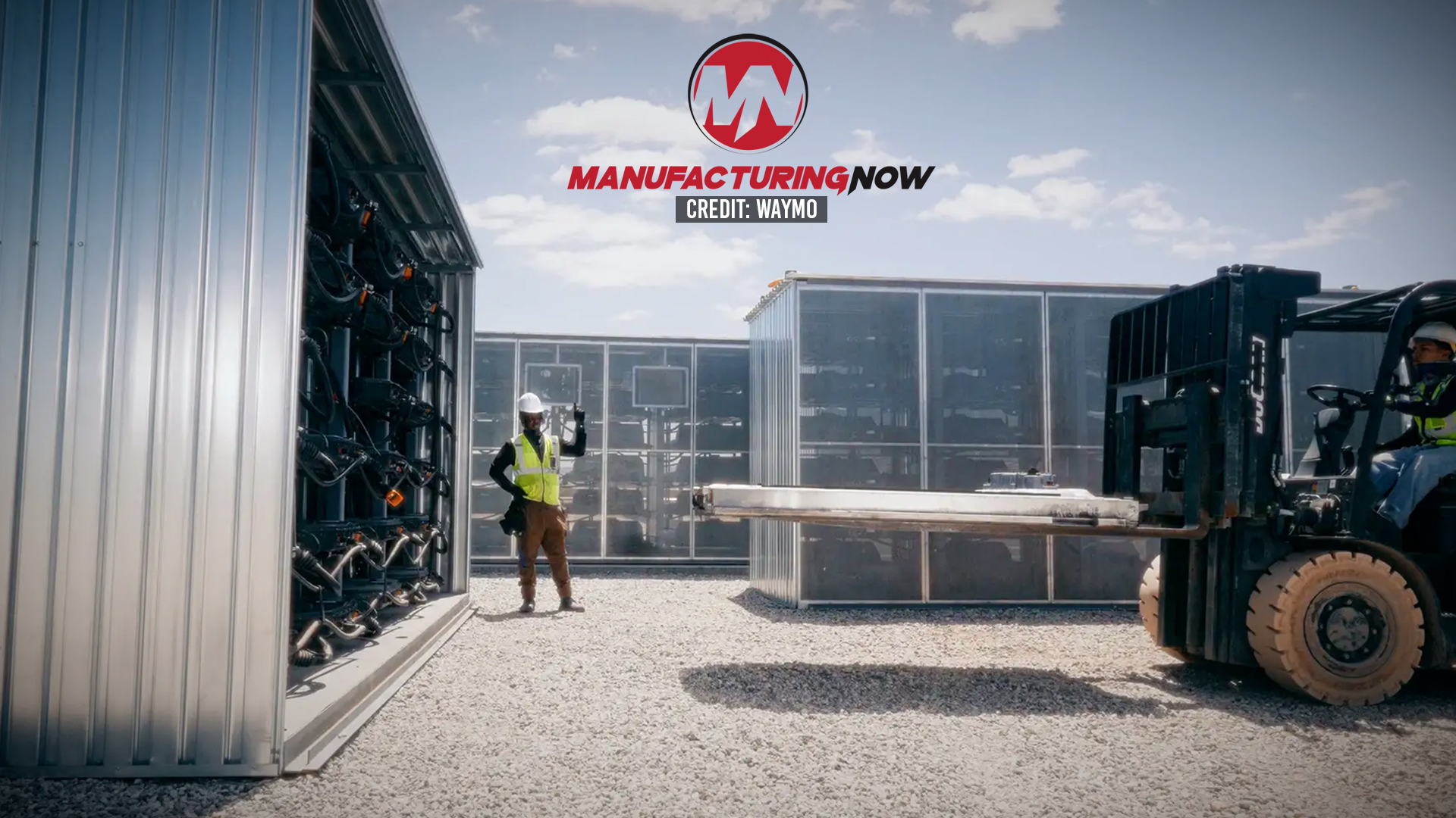 Industrial warehouse scene with workers loading shipping containers using a forklift under ManufacturingNow branding