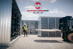 Industrial warehouse scene with workers loading shipping containers using a forklift under ManufacturingNow branding