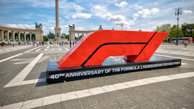 Red Formula 1 logo monument celebrating 40th anniversary of Hungarian Grand Prix in Heroes' Square, Budapest