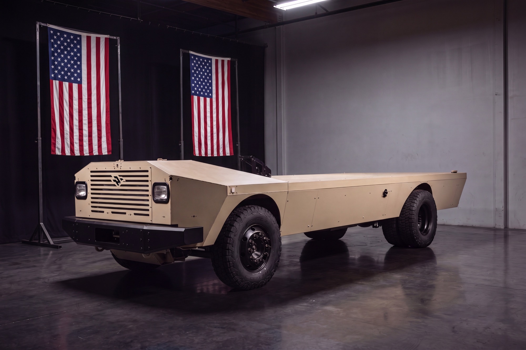Vintage International Harvester truck displayed in showroom with American flags