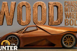 Wooden sculpture of a sports car with 'WOOD' text and Barn Hunter Find watermark