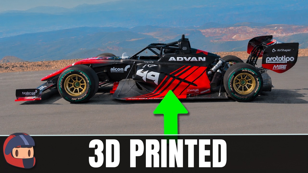 Red and black 3D printed race car model with sponsor logos displayed on mountain landscape background