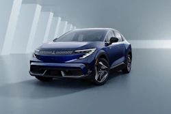 Blue Peugeot 3008 electric SUV displayed in a modern studio setting with geometric white architectural backdrop