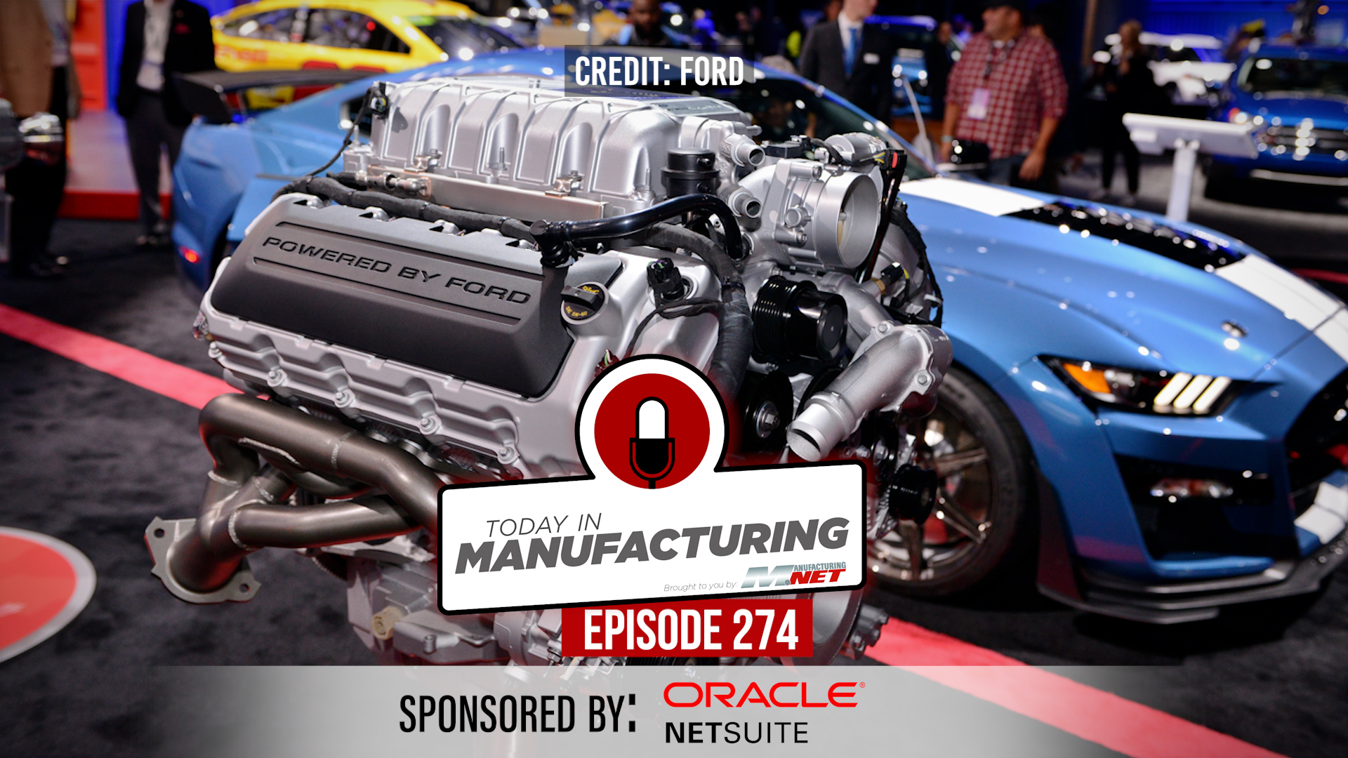 Ford supercharged engine display at automotive trade show with blue Mustang in background, sponsored by Oracle NetSuite