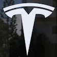 Tesla logo - white stylized T symbol