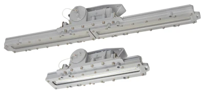 Two gray industrial LED lighting fixtures with mounting brackets and electrical connectors for hazardous area applications