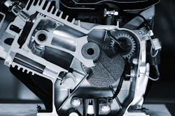 Cross-sectional view of internal combustion engine showing pistons, gears, cylinders, and metal mechanical components