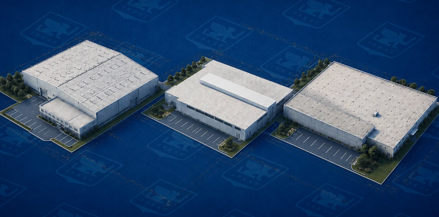Three white industrial warehouse buildings in isometric view with parking areas on blue background