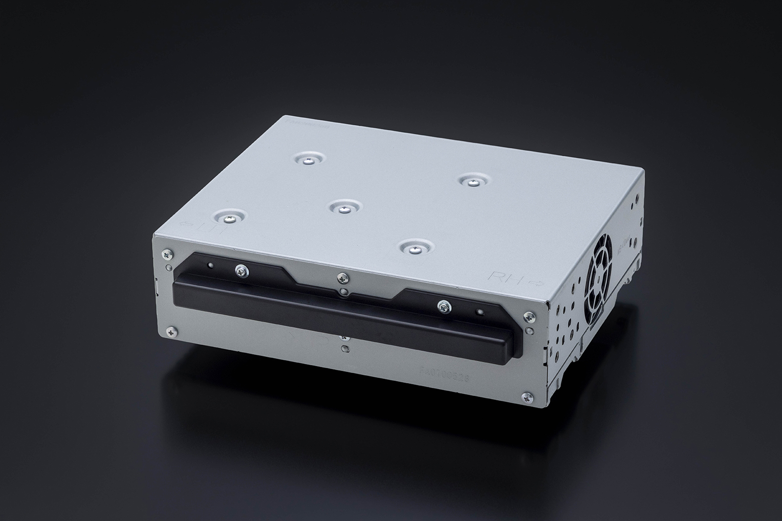 White metal industrial enclosure with black front panel, ventilation holes, and mounting fasteners on dark background