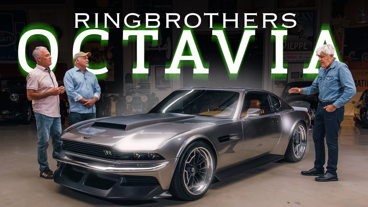 Three men stand beside a silver and black custom Octavia sports car in a workshop garage setting with Ringbrothers branding