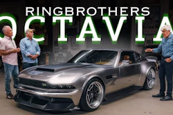 Three men stand beside a silver and black custom Octavia sports car in a workshop garage setting with Ringbrothers branding