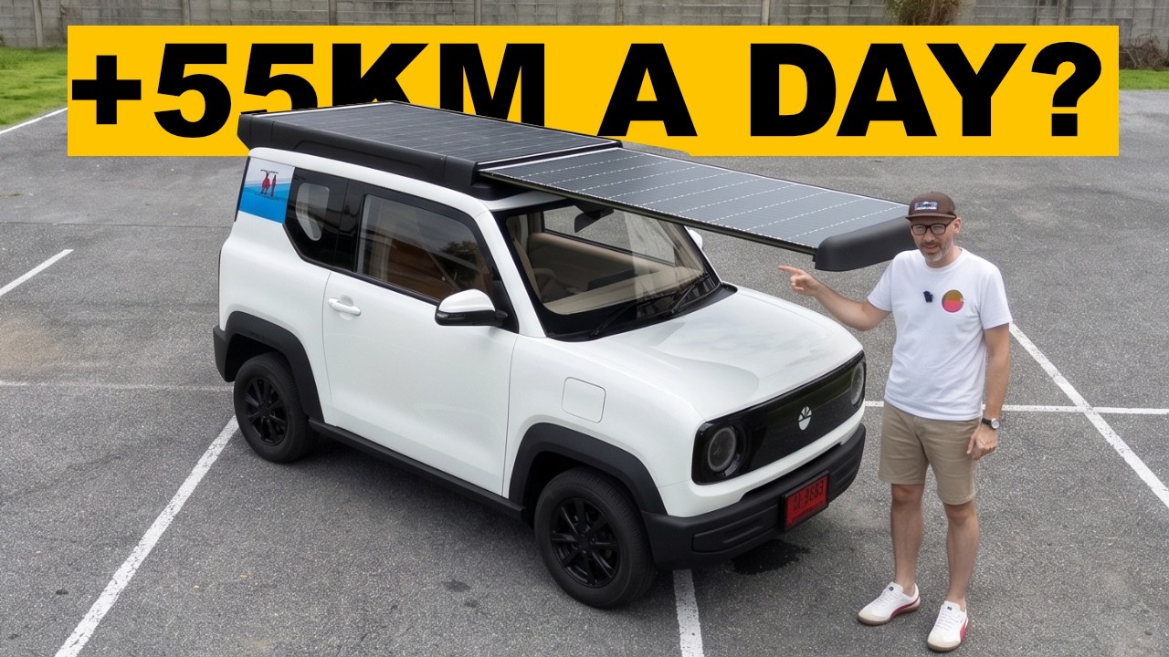 White compact SUV with roof rack and person in parking lot with yellow banner text