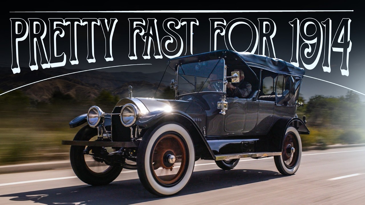 Vintage 1914 black automobile driving on road with 'Pretty Fast for 1914' text overlay