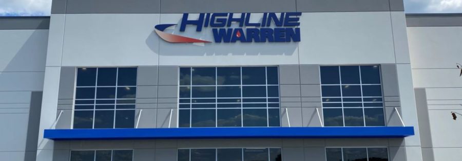 Highline Warren storefront with blue and red logo on modern commercial building facade