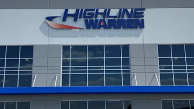 Highline Warren storefront with blue and red logo on modern commercial building facade