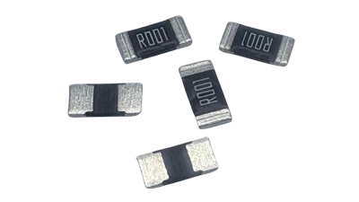 Five surface-mount resistor components with silver end caps and black marking bands displaying alphanumeric codes