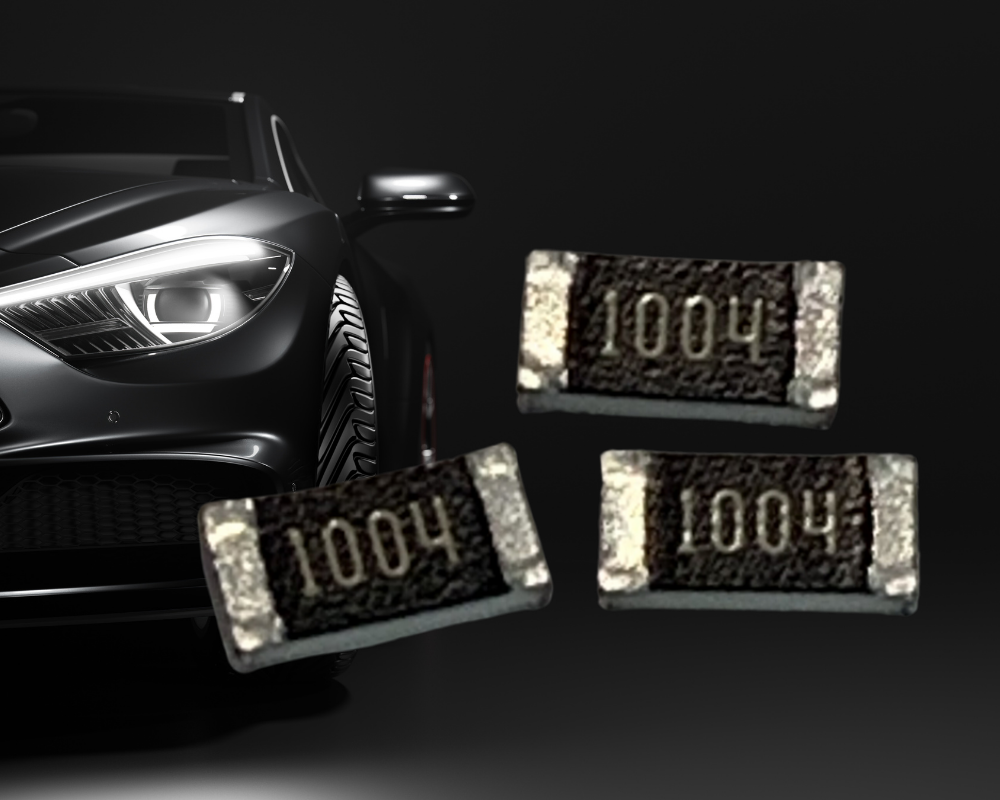 Luxury vehicle headlight with surface-mount resistor components marked 1004 displayed against dark background