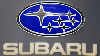 Subaru logo featuring blue oval badge with white star symbols and beige text