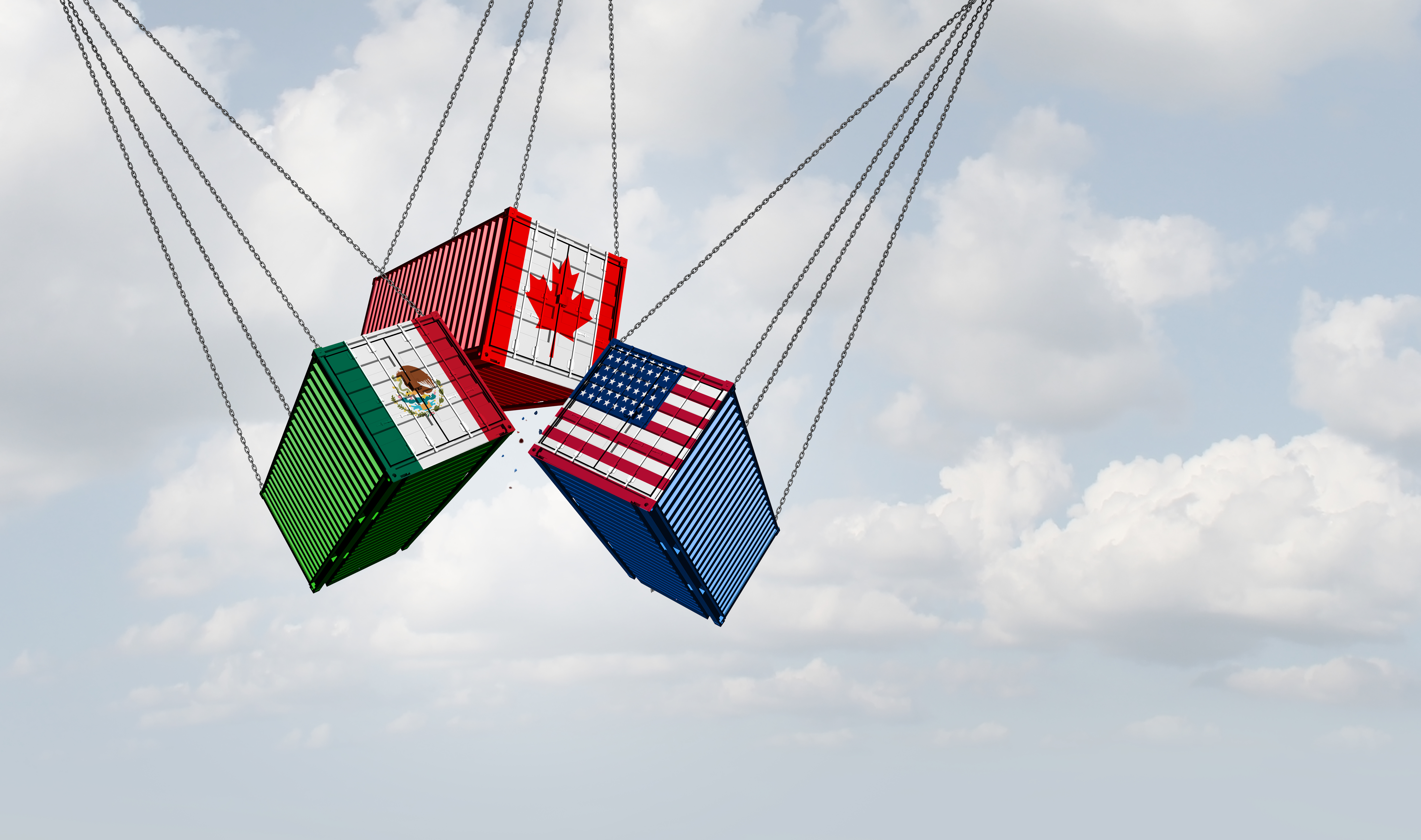 Three shipping containers decorated with Canadian, Mexican, and American flags suspended by cables against a blue sky