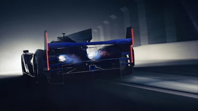 Blue high-performance race car with red lights driving through modern urban tunnel with motion blur