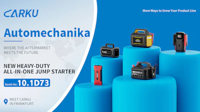 CARKU Automechanika booth display featuring heavy-duty jump starters on blue platforms