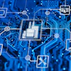 Digital circuit board network with interconnected technology icons including CPU, IoT, and robotic systems on blue background