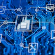 Digital circuit board network with interconnected technology icons including CPU, IoT, and robotic systems on blue background