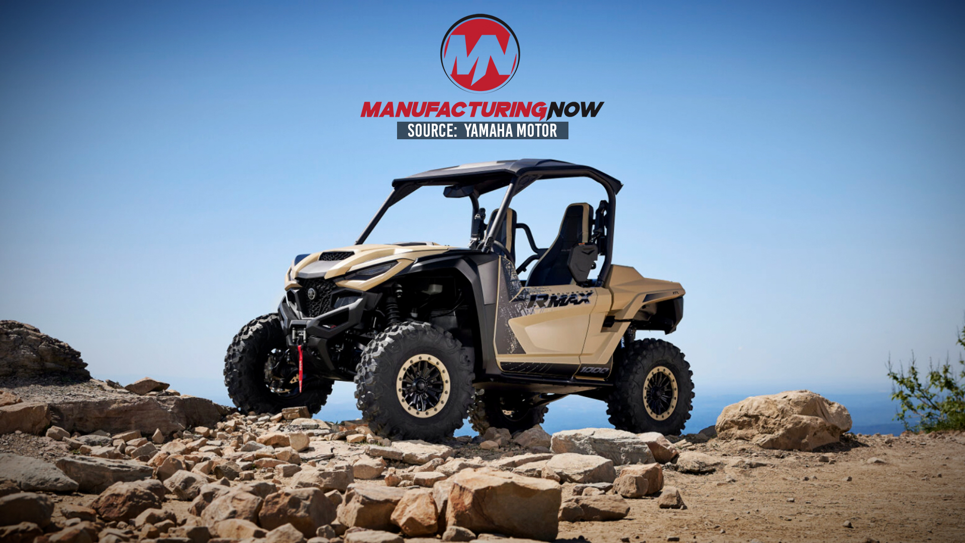 Tan Yamaha Motor UTV on rocky terrain with ocean backdrop under clear blue sky