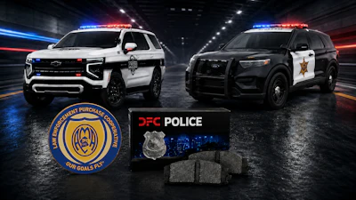 Two police SUVs with DFC Police emblems and badges displayed in urban setting with blue and red emergency lights